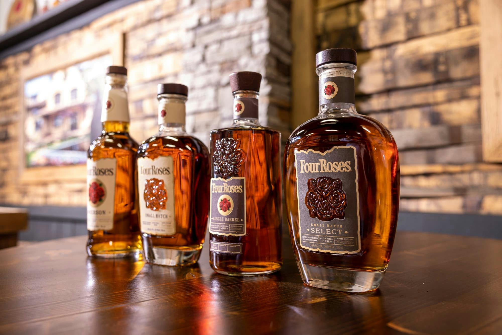 A lineup of Four Roses Bourbon, Small Batch, Single Barrel, and Small Batch Select.
